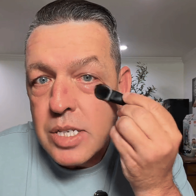 Man applying face tightener